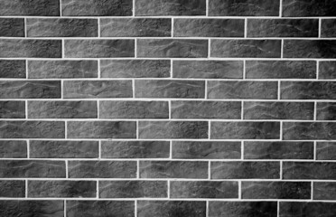 Modern grey block brick wallpaper pattern concept. Close up gray tiles brick wall texture background. 