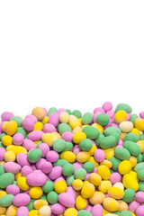 Group of colorful peanuts in glaze.