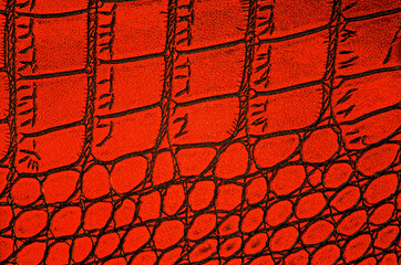 Crocodile genuine leather background. Red alligator patterned background.