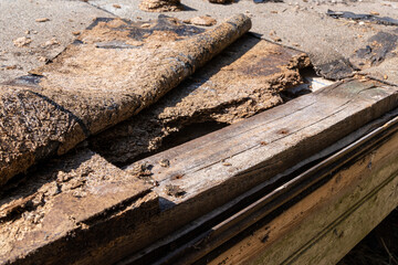 defectation - damaged roof waterproofing and broken OSB boards