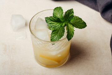 Lemonade with ice and mint in the glass