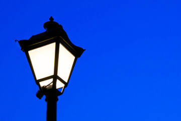 Fototapeta na wymiar Stylish, black outdoor park lamp
