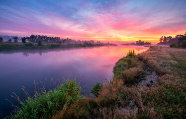 Colorful sunrise over the river banks