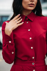Attractive lady in fashion dress posing on the street