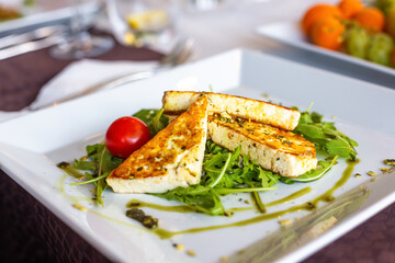 Grilled Halloumi Cheese and roasted tomato salad.