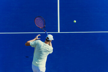 tennis player on blue court