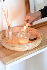lighting with a match a scented candle