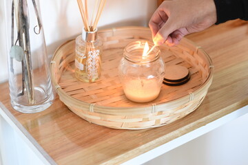 lighting with a match a scented candle