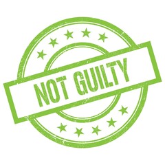 NOT GUILTY text written on green vintage stamp.