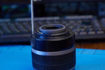 We disassemble the lens with a screwdriver closeup