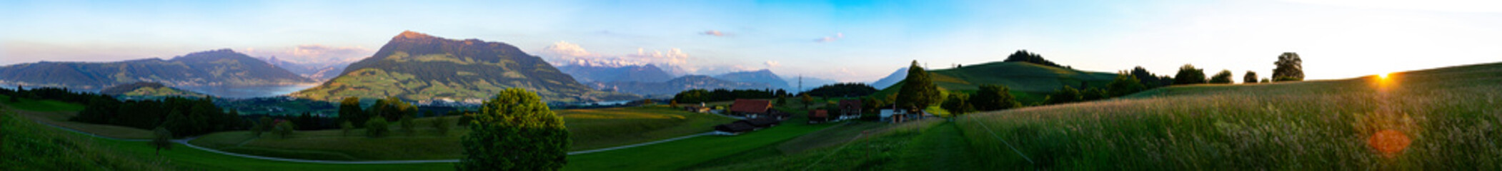 Wide panorama of mountains i Switzerland with view of Zug and Rigi.