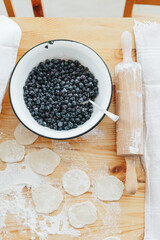 Process of making sweet varenyky vareniki pierogi with berries traditional ukrainian food. High quality photo