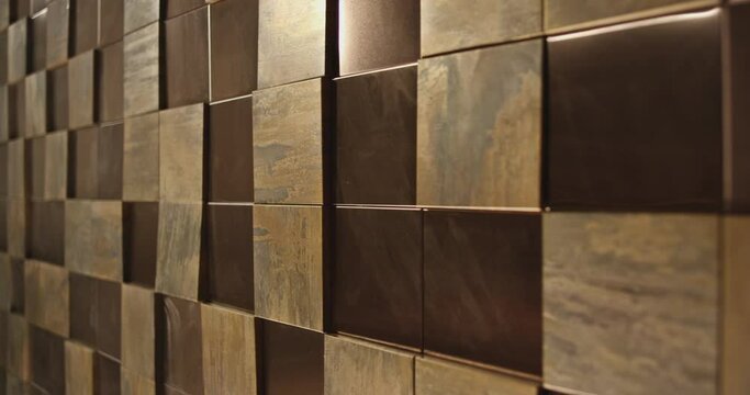 4K Golden square blocks background . Abstract 3D Golden Metal Cubes . Wall with gold, copper or metallic tile, boxes .  Shot on RED DRAGON Cinema camera .