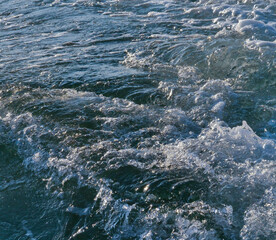 Fototapeta premium Big splashing waves produced by a boat engine