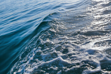 Big splashing waves produced by a boat engine