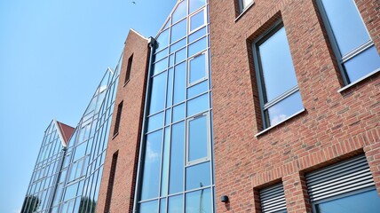 Detailed view of modern townhouses in row of. Original townhouses in a residential area. Buildings predominantly made of glass, steel and concrete.