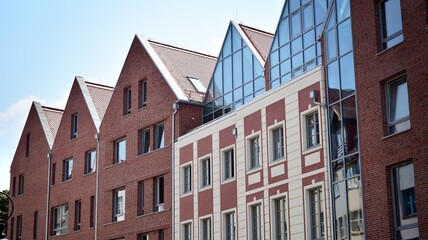 Detailed view of modern townhouses in row of. Original townhouses in a residential area. Buildings predominantly made of glass, steel and concrete.