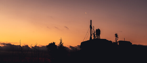Fototapeta na wymiar Silhouette of couple on sunset, Sumava, Czech republic