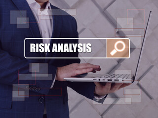  RISK ANALYSIS phrase on the screen. Merchant use internet technologies at office.