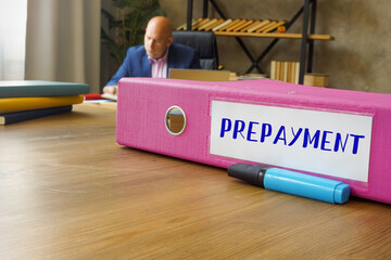Financial concept about PREPAYMENT with inscription on the File Folder.