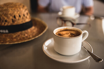 close-up cup of coffee and hat