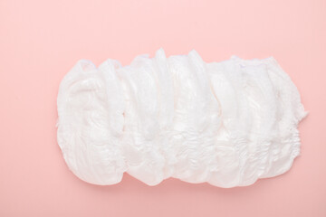 Obraz premium Diapers are disposable panties on a pink background with a place to copy. top view, copy space.