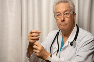 Medical doctor holding up empty space in hands