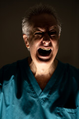 Light and shadow contrast photo of a doctor screaming