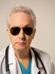 Transgender LGBT doctor wearing cool sunglasses and pink lipstick