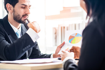 businessman serious about the company's earnings or stock growth with business woman