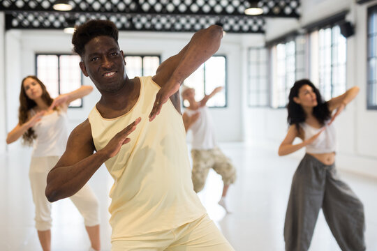 Dancers training contemporary dance movements during rehearsal © JackF