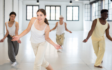 People learning swing steps at dance class