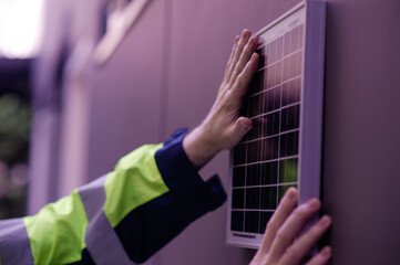 Obraz premium Engineer solar cells caucasian working install and the work area.