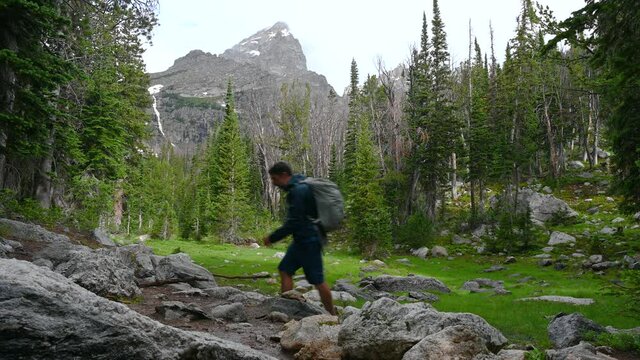 Hiking past mountain in Grand Teton National Park, Wyoming, USA