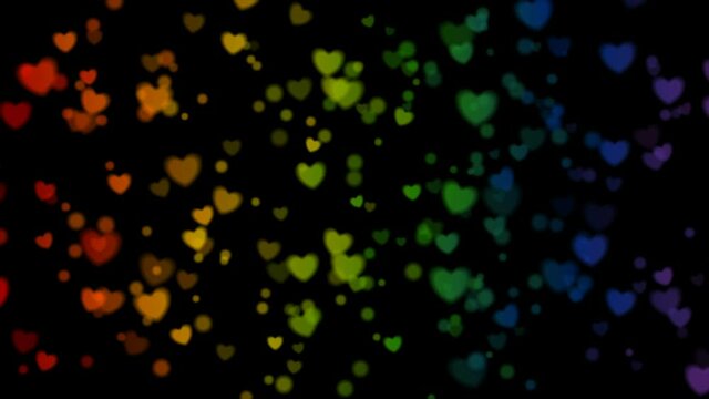 LGBTQ Pride Month abstract colorful motion background with blurred hearts. Seamless looping. Video animation Ultra HD 4K 3840x2160