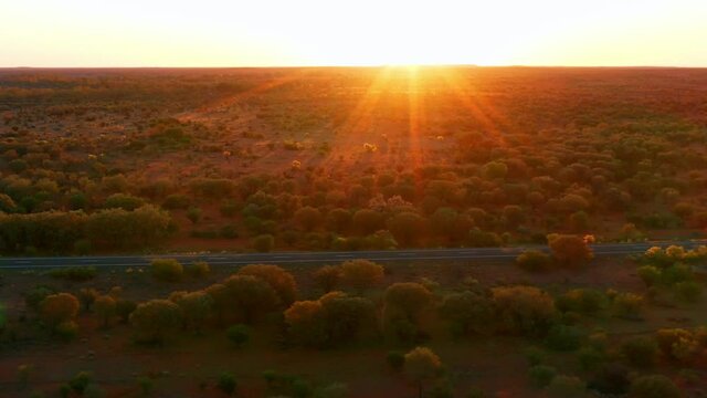 Vibrant Sun Rays Over Vegetation Landscape Along Stuart Highway In South Australia. - Aerial Drone Shot
