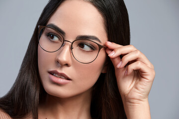 Fashion, stylish woman with glasses in stylish frames, posing at the camera, advertising glasses,...