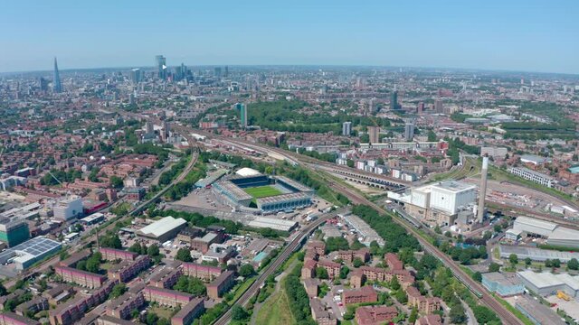 Dolly forward drone shot over Bermondsy millwall stadium London skyline