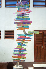 Directional sign with colorful arrows showing distances to Major Cities.