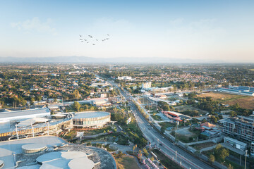Aerial view of highway road and bridge at intersection or junction. Infrastructure building in Chiang Mai city of Thailand. Many lane of street meet and cross. Busy with traffic, car, truck or vehicle