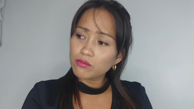 A Sad Young Asian Woman