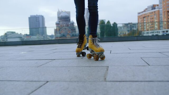 Woman legs making steps on rollerblades outside. Roller skater riding outdoor.