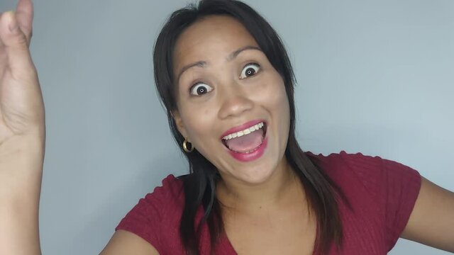 An Asian Woman Funny Faces Peekaboo