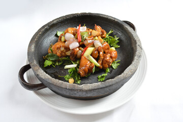stir fried chicken meat with mala spicy sauce xiang guo in hot stone pot in white background asian halal menu