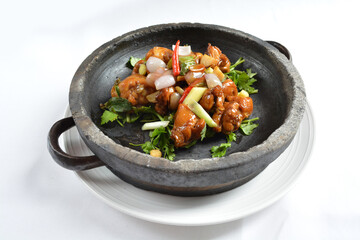 stir fried chicken meat with mala spicy sauce xiang guo in hot stone pot in white background asian halal menu