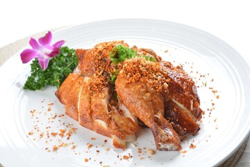 roasted bbq golden crispy whole chicken meat with crackers in white background asian halal menu
