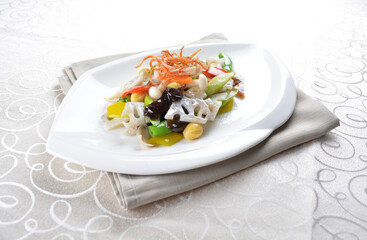 stir fried mixed vegetables with lotus root and seed in soy sauce in white background asian halal menu
