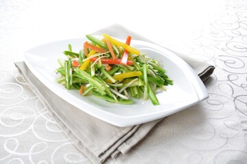 stir fried slices green dragon vegetables in soy sauce in white background asian halal menu
