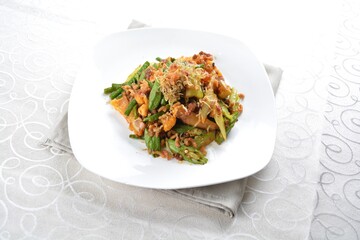 stir fried mixed vegetables with meat in spicy samba chilli sauce in white background asian halal menu