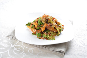 stir fried mixed vegetables with meat in spicy samba chilli sauce in white background asian halal menu